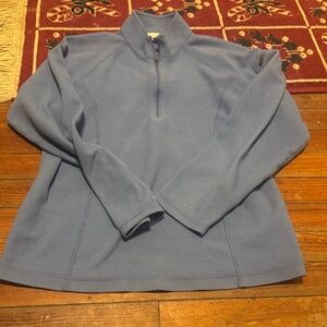 Stay warm and stylish with this blue quarter-zip fleece. Perfect for any casual